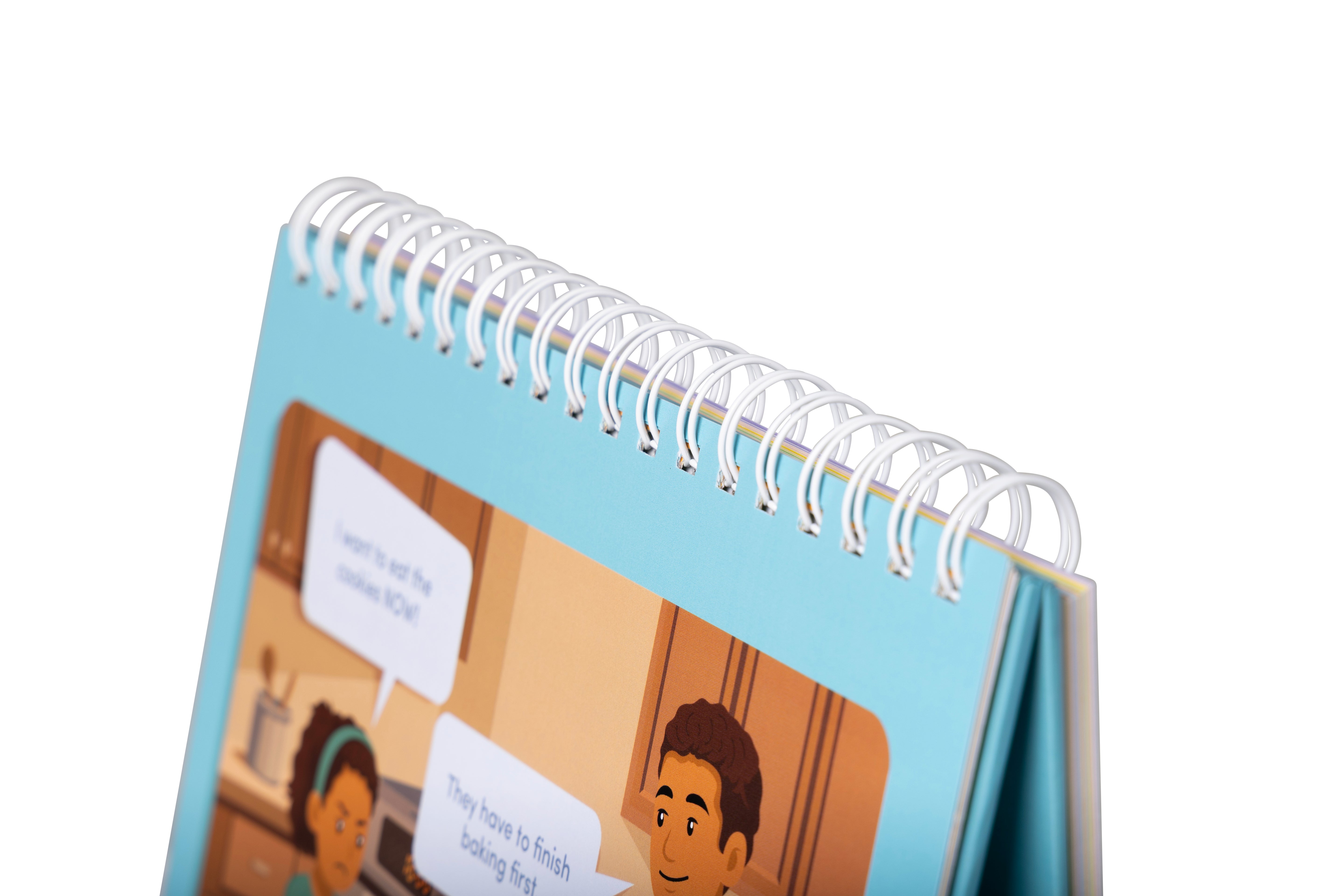 Small spiral-bound book with cartoon illustrations on a white background